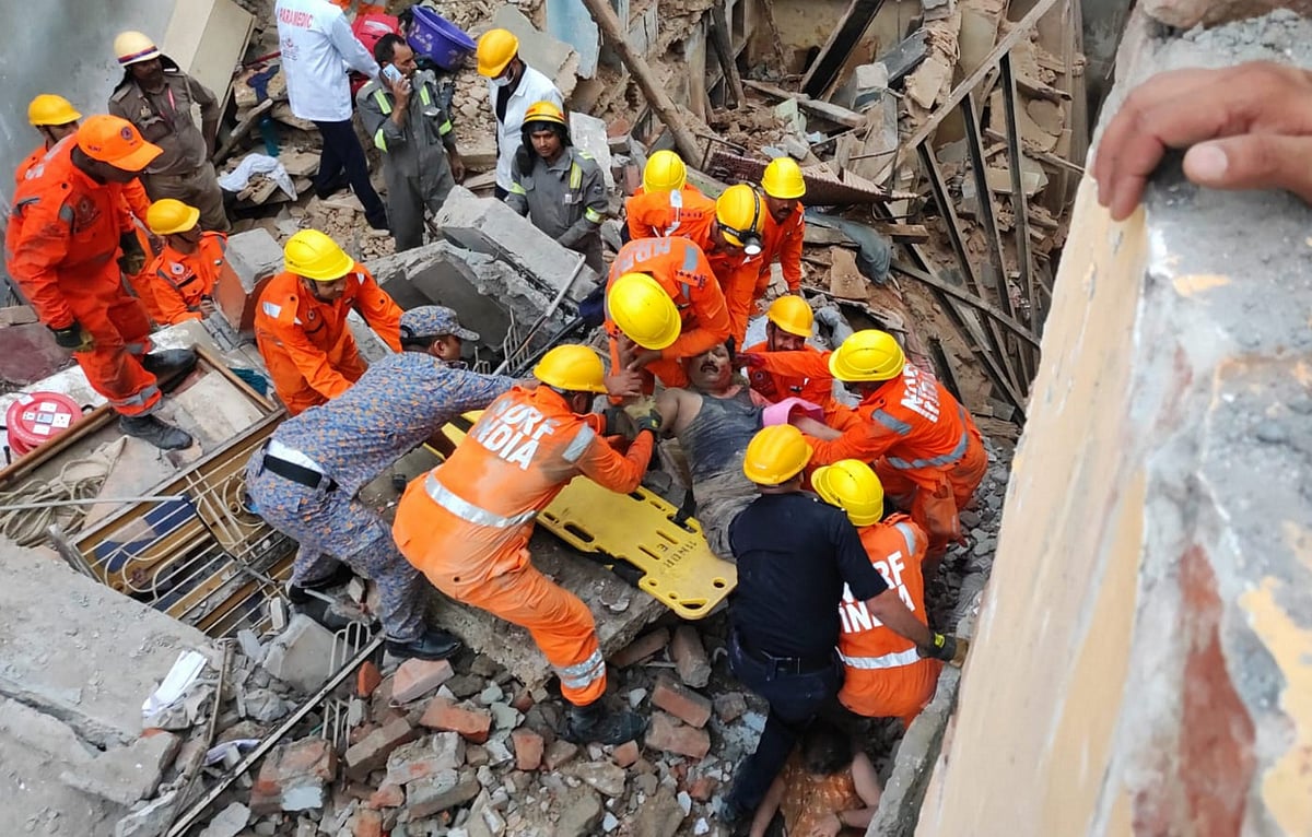 PTI : NDRF personnel carry out rescue work after two houses collapsed near the Kashi Vishwanath temple, in Varanasi, Tuesday, Aug. 6, 2024. A woman died in the mishap